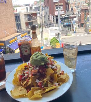 Sharing size portion of nachos   at California Kitchen & Craft Pub in Seoul