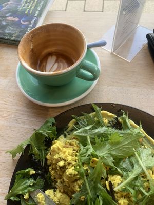 Close up tofu scramble and coconut flat white   at Bonobo Cafe in Christchurch