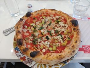 Vegan pizza with vegan mozzarella, mushrooms and zucchini.  at Rossopomodoro in Rimini
