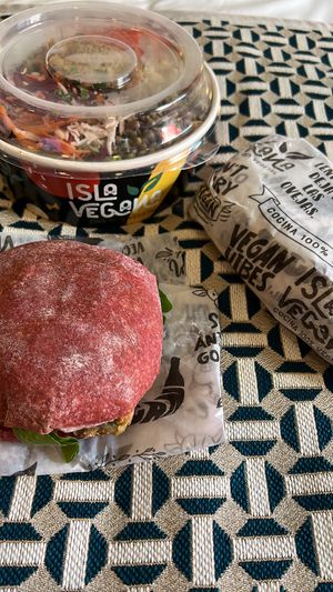 Beetroot bun, salad if the day and wrap. All yummy.  at Isla Vegana in Ushuaia