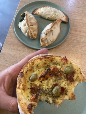 Vegan pizza bread, spinach empanadas and cheese empanadass  at Isla Vegana in Ushuaia