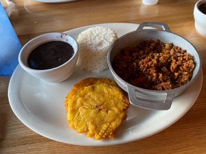 Vegan picadillo with tostones, black beans, and white rice. at Smokies Cuban Cafe in Pigeon Forge