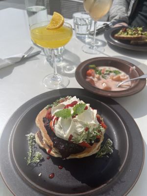 American pancakes, mimosa, rhubarb sprits, yoghurt parfait (vegan specified), avocado toast (vegan version specified)   at Kumi Oslobukta in Oslo