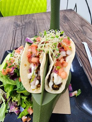 Impossible black bean tacos w/ pico and garlic crema 😋 at Cocina Plantosaurus in Charles Town