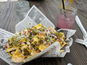 Nachos and hibiscus lemonade  at Cocina Plantosaurus in Charles Town