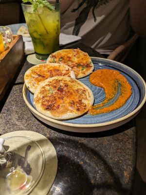 Savory pancakes with spiced tomato sauce at Little Andaman in Barcelona