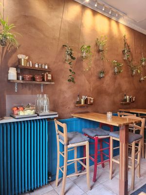 Side salad and water station at Reggev Hummus Södermalm in Stockholm