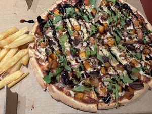 Great service! Pumpkin, red onion, baby spinach, balsamic glaze with vegan cheese and best hot chips!! Also catered for fussy vegan son with a BBQ base, red onion, vegan cheese  at Bella Cafe Restaurant & Pizza Bar in Kangaroo Island