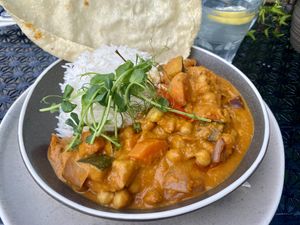 Vegan curry with rice, chickpeas, sweet potato and papadum.  at Guy's Bar in Clifden