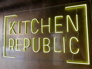 Logo at entrance at Kitchen Republic in Basel