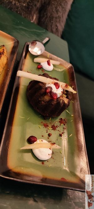 Rich chocolate cake, gluten-free, Fresh pear pieces, Vanilla soy cream at B.Better in Paris