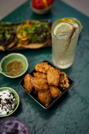 Tapas with homemade drinks and sauces at B.Better in Paris