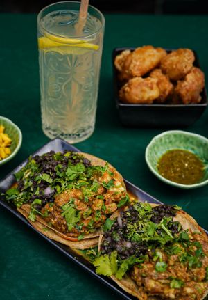 Quesadillas with homemade hot sauce and cold drinks at B.Better in Paris