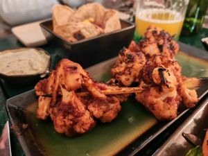 Mini cauliflower skewer glazed with homemade BBQ sauce, BBQ-grilled* at B.Better in Paris