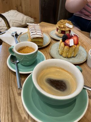 Espresso; Mille Feuille; Macaron aux pistaches; Charlotte; café allongée   at Land & Monkeys - Turenne in Paris