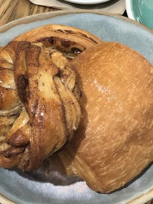 From left to right, cinnamon roll, pain aux raisins, and pain au chocolat  at Land & Monkeys - Turenne in Paris
