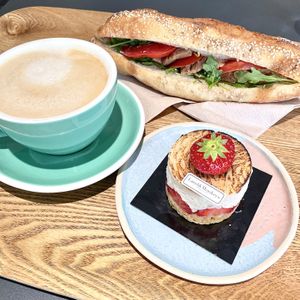 Strawberry Entrement; Baguette w/ Smoked Soy, Arugula, Tomatoes, and Mayo; Oat Latte.   at Land & Monkeys - Turenne in Paris