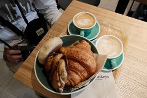 Cappuccinos, croissants, and pastry  at Land & Monkeys - Turenne in Paris