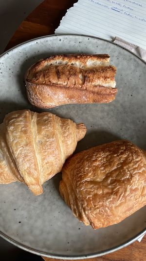 Piece of baguette, croissant and pain au chocolat (taken home)  at Land & Monkeys - Turenne in Paris