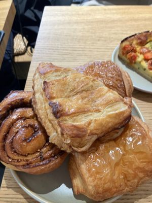 There is a apple turnover(top), a kind of baklava roll with candied pistachios (to the left) , and two of the most amazing chocolate croissant (right and back) at Land & Monkeys - Turenne in Paris