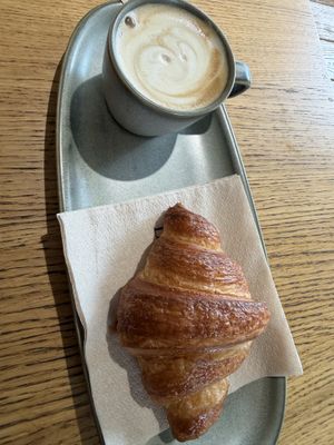 Oat cappuccino and croissantt  at Land & Monkeys - Turenne in Paris