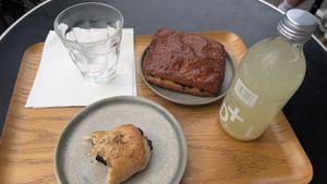 Olive bread, chocolate chip donut with lemon ginger juice at Land & Monkeys - Turenne in Paris