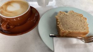 Cappuccino with oatmilk and vegan hazelnut cake  at ChiCoffee in Neuss