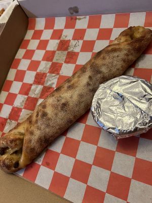 Snausage roll with onions  at Attilio's Pizzeria in Toms River