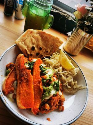 Roasted butternut squash on Lentils and chickpeas in a spicy apricot tomato and ginger sauce. at Döner Bei Tante Anne in Norwich