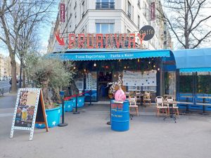 Restaurant located at a street corner at Broadway Caffe in Paris