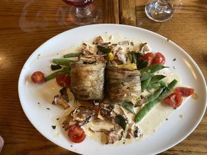 Roasted eggplant with polenta, chanterelle mushrooms, tomatoes, snap peas, sage, and vegan cream sauce  at Mountain Brauhaus in Gardiner