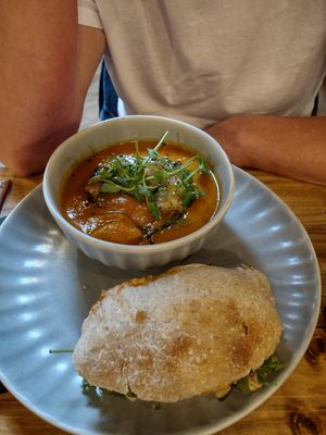 Sweet potato and harissa soup with vegetable and hummus sourdough roll at Wild Root in Southport