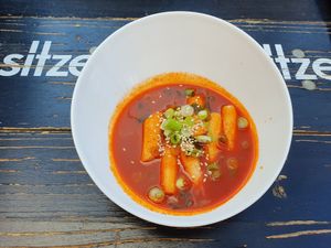 Tteokbokki: spicy ricecake sticks, can be used as starter at Omma's Kitchen in Enschede