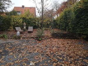 Garden linked to Haan at B&B Dageraad in Bocholt