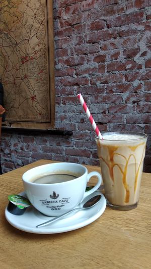 Grande coffee and ice coffee at Barista Cafe in The Hague