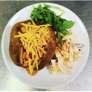 Jacket potato with beans and vegan cheese at Nosh in Leeds