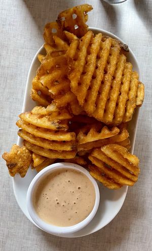 Vegan waffle fries and chipotle aioli  at Stoked Pizza Co in Cambridge