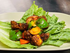 Plant based chilli mushroom tossed with capsicum and onion  at The Sage Village in Campbelltown