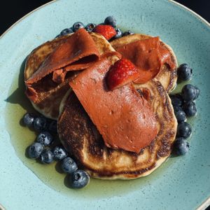 Pancakes with blueberries and vegan bacon  at Holy Cow Lounge in Edinburgh