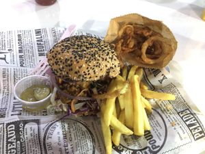 Vegan pork burger with fries and onion rings  at PINK BOX - Ruam Chok in Chiang Mai