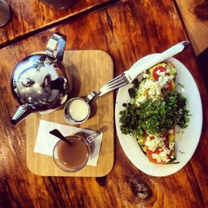 Organic sourdough toast with smashed avocado, feta, tomato and fresh herbs.  at Heart and Soul Organic Chai Cafe in Cronulla