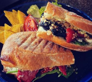 Mediterranean vegetables, black olives, vegan feta, quinoa, baby spinach and basil dressing, in a lightly toasted sourdough ciabatta. at Curran Geal in Edinburgh
