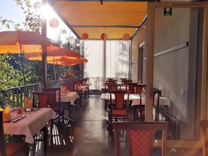 Terrace seating in the back at Indian BBQ in Zurich