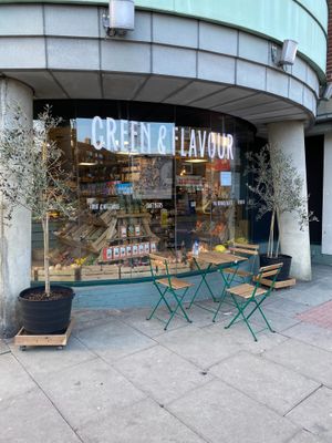 Exterior of shop and outside seating at Green & Flavour in North London