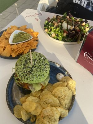 Vegan burger and veggie salad which was my friends   at Fika in Viana Do Castelo