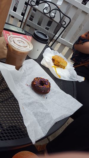 Mocha, latte, donut, and breakfast sandwich at Mud Pie Vegan Bakery and Coffee in Kansas City