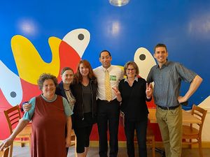 Group photo in their party room at Pizzeria Paradiso in Washington