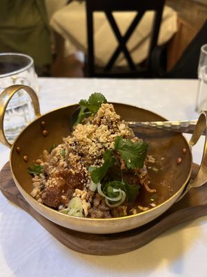 Gyo Grob Tom Yum Kluk Klik (Dumplings in Omni mince and peanut sauce)  at Mali Vegan Thai in South West London