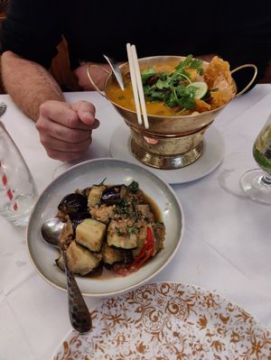 Aubergine dish with vegan ground meat and delicious zesty soup behind (galangal, kefir lime leaves, chili, coriander) at Mali Vegan Thai in South West London