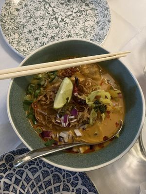 Kao Soi - a beautiful yellow curry noodle soup with fresh, zingy, and soothing flavours.  at Mali Vegan Thai in South West London
